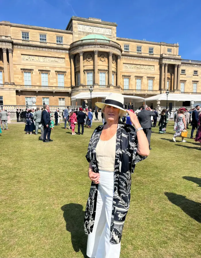 Jo standing in the garden of Buckingham Palace